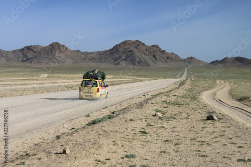 Mongol Rally Car driving across desert
