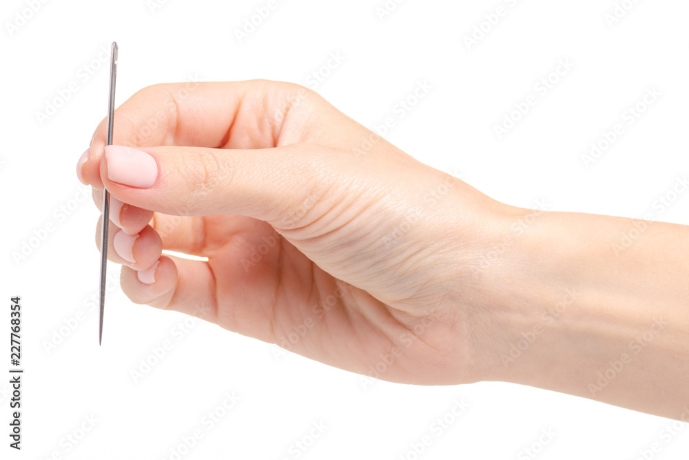 sewing needle in hand on a white background. Isolation sewing needle in hand on a white background. Isolation