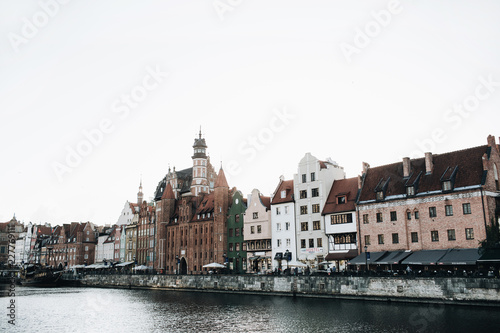 September 1, 2018 - Gdansk / Poland: Architecture of Gdansk, Poland in pier in Old Town Center. Buildings and old ship.
