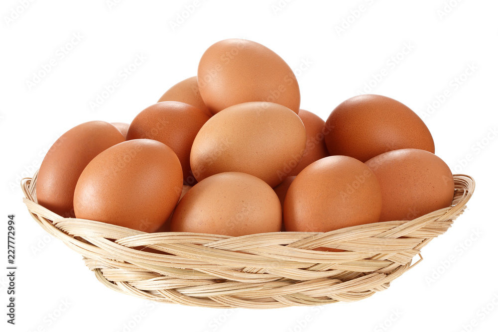 Eggs in a wicker basket. Isolated on white background. Eggs in a wicker basket. Isolated on white background.