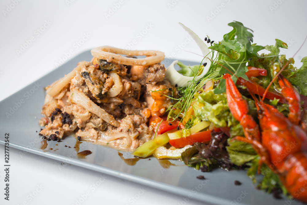 Seafood salad with squid, crayfish, mussels and green Seafood salad with squid, crayfish, mussels and green
