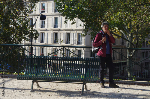 A man walks in the streets and parks of Paris