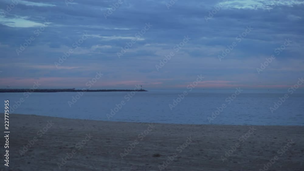 Background plate of Sunset on a California beach with a jetty in the ocean Background plate of Sunset on a California beach with a jetty in the ocean
