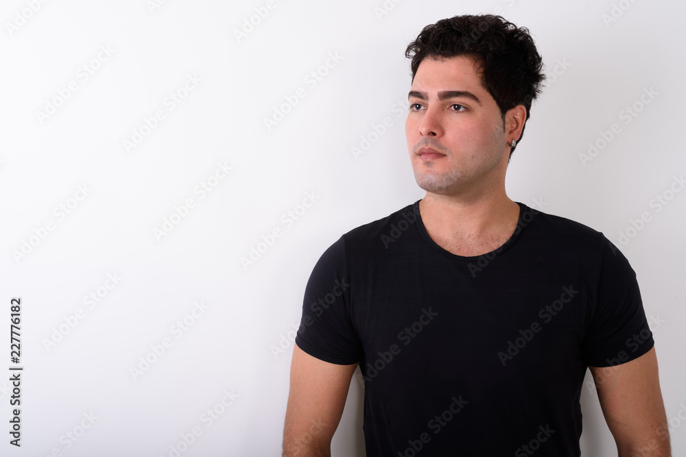 Young handsome Persian man against white background Young handsome Persian man against white background