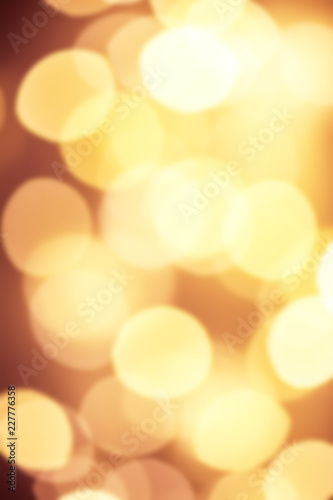 Goldn  Lights Festive background. Abstract Christmas twinkled bright background with bokeh defocused yellow lights © nataliazakharova