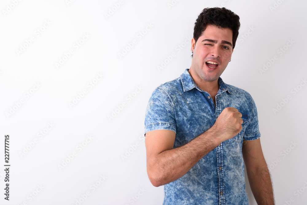 Young handsome Persian man against white background Young handsome Persian man against white background