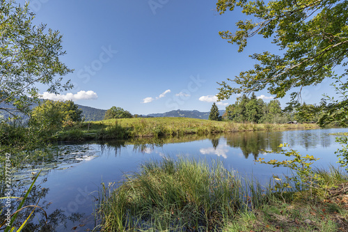 Clouds are reflected on the Moorweiher at Oberstdorf / Bavaria © Manninx