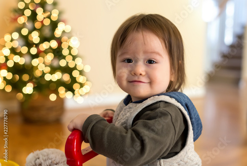 Toddler boy in his house around Christmas time