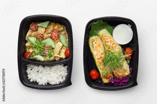 Set of take away difhes in black containers