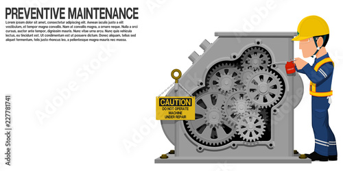 An industrial worker is lubricating the machine
