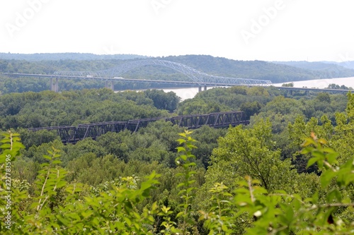 A view of the highway steel bridge from the forest. 