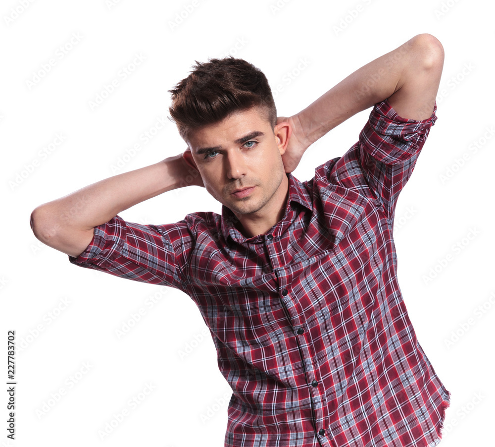 portrait of seductive man in shirt with checkers holding neck portrait of seductive man in shirt with checkers holding neck