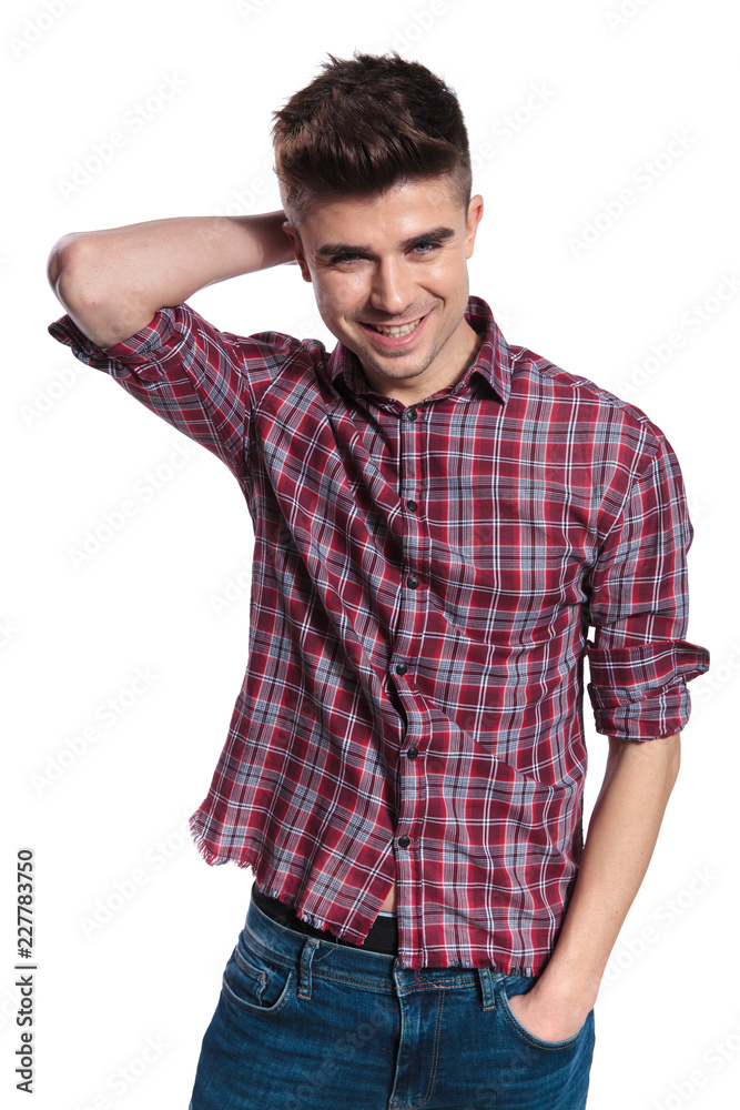 portrait of relaxed casual man holding neck and smiling portrait of relaxed casual man holding neck and smiling