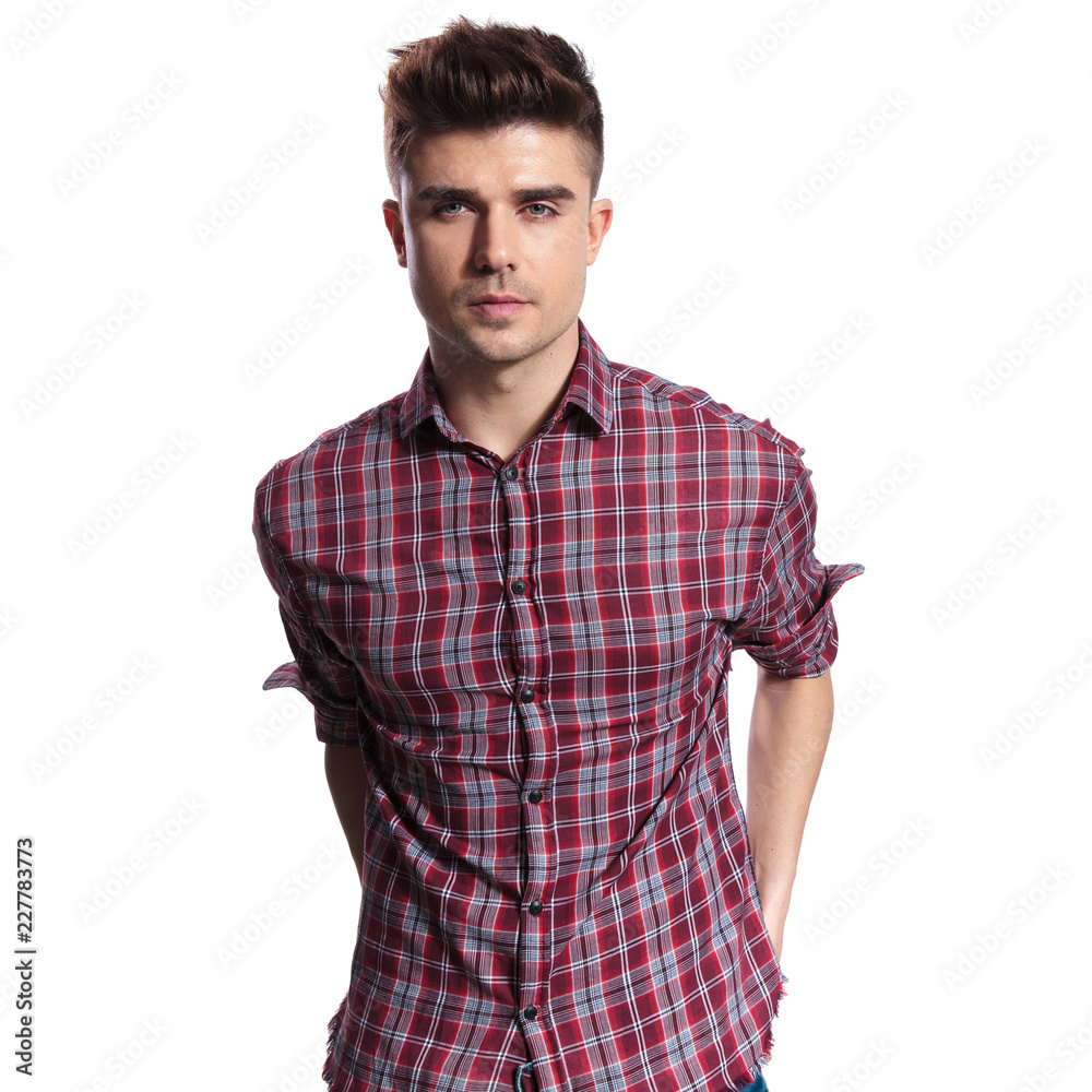 portrait of handsome man wearing a shirt with red checkers