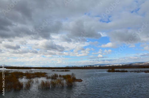 A riverside with mountains