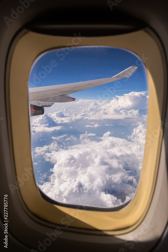 clouds sky skyscape and Wing of airplane with skyline top view. view from the window of an airplane flying in the clouds  top view clouds like  the sea of clouds sky background