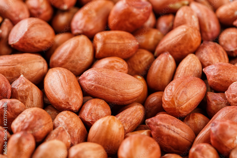 Peanuts, for background or textures. Uncleaned inshell peanuts. Peanuts, for background or textures. Uncleaned inshell peanuts.