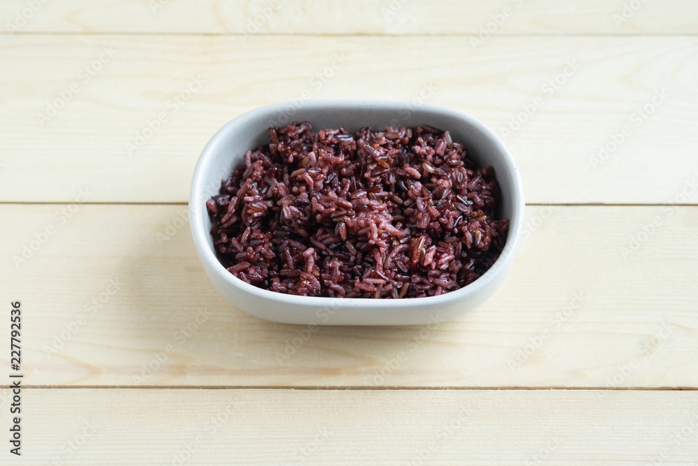 Organic riceberry in ceramic bowl Organic riceberry in ceramic bowl