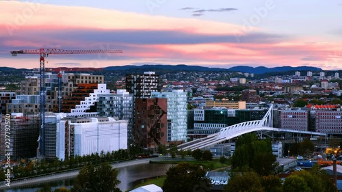 Oslo, Norway. A sunrise view of Sentrum area of Oslo, Norway, with Barcode buildings and the river Akerselva. Construction site with morning colorful sky photo