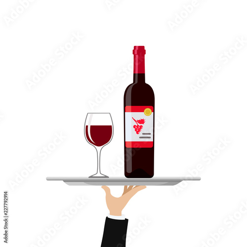 Bottle of red wine and glass on tray © TanyaBegun