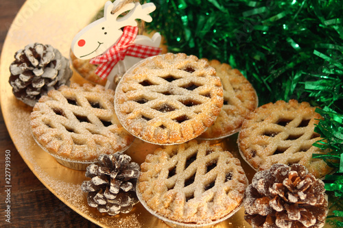 Christmas mince pies on a wooden background
