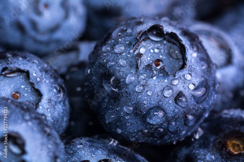 Fresh ripe blueberries with drops of dew. Berry background. Macro photo. photo