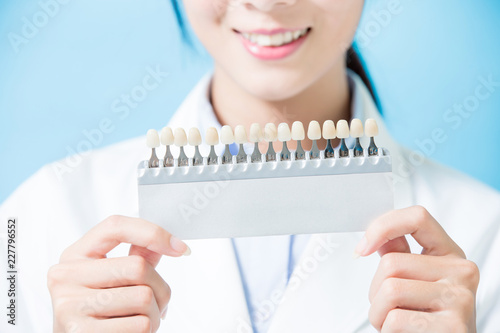 dentist take tooth whitening tool