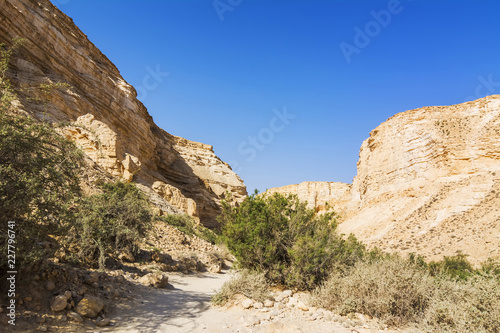 Makhtesh Ramon crater mountains park view with trekking path - geological site in Negev desert