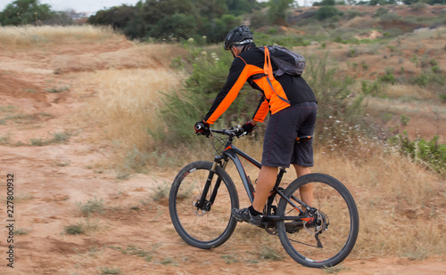 mountain biker ride in the filed