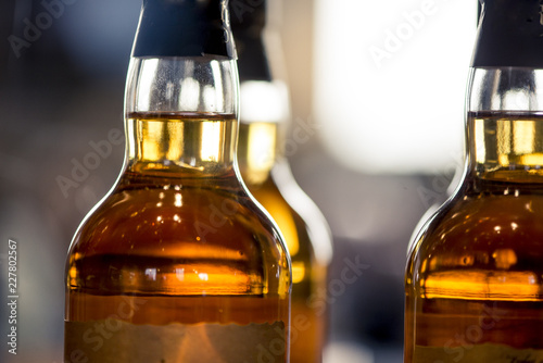 Whisky bottles, macro shot backlit