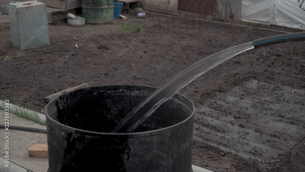 in the barrel water is collected from a hose in the barrel water is collected from a hose