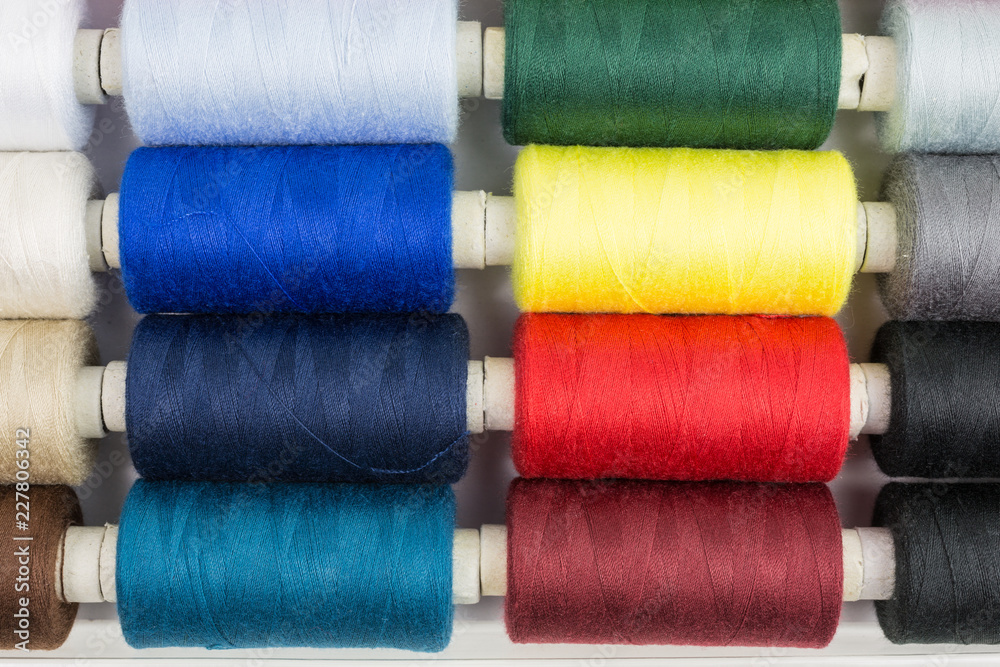 spools of sewing thread in various colors spools of sewing thread in various colors