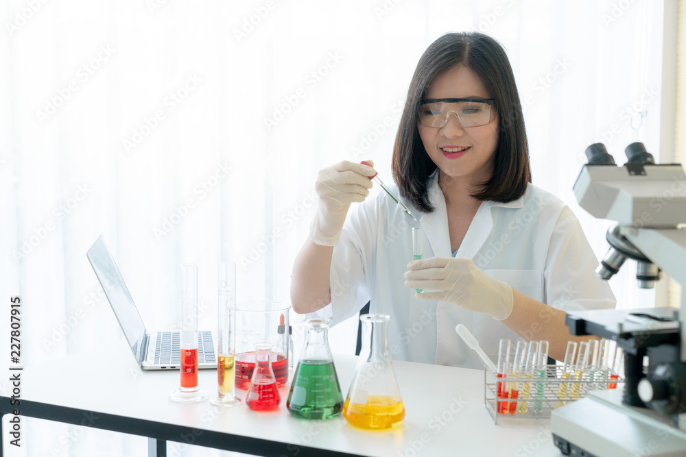 Scientist work researching about chemical in laboratory Scientist work researching about chemical in laboratory