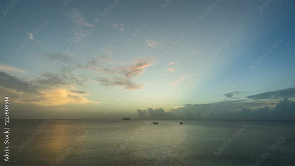 Sunset above ocean horizon with moving clouds. Timelapse day to night transition Sunset above ocean horizon with moving clouds. Timelapse day to night transition