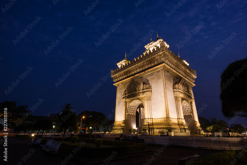 Lit Patuxai (Patuxay), Victory Gate or Gate of Triumph, war monument in Vientiane, Laos, at dusk.