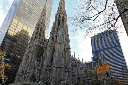 New York, USA - November 20: View of the facade of St. Patrick's Cathedral and skyscrapers in New York City, © JEROME LABOUYRIE