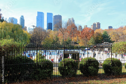 New York, USA - November 21, 2010: Central Park Autumn and buildings in midtown Manhattan New York City