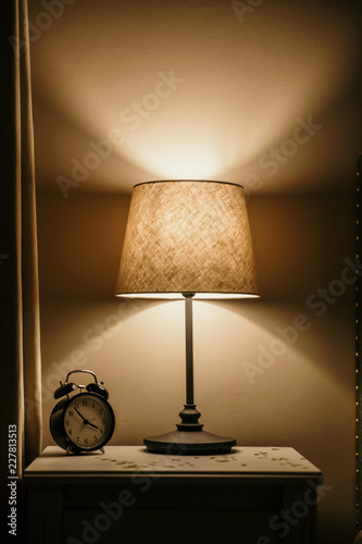 night light and alarm clock on the bedside table