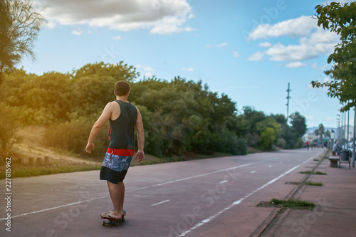 man running on skate on a country road