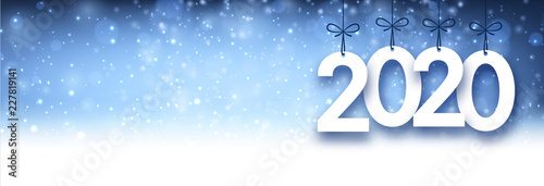 Blue shiny 2020 New Year banner with snow.