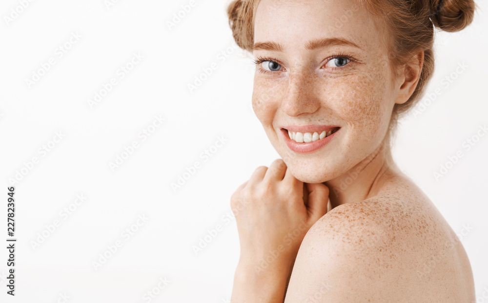 Close-up shot of tender and feminine good-looking ginger female