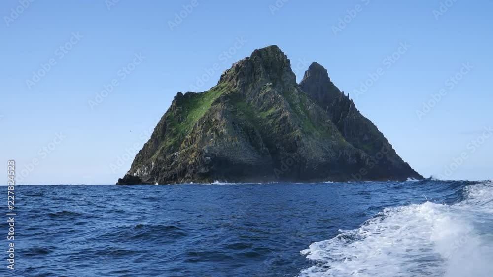 Approaching the Irish island Skellig Michael with a boat Approaching the Irish island Skellig Michael with a boat