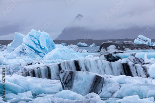 Blue ice at Jokulsarlon glacier lagoon in Iceland photo