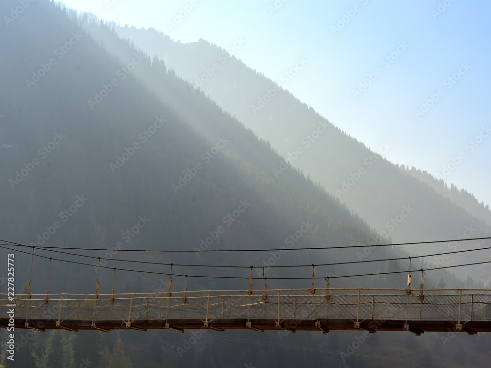 Fototapeta premium Rope bridge in the mountains