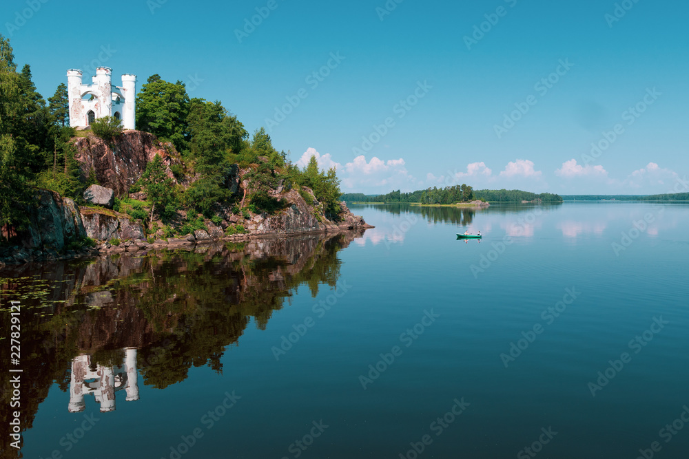 island in the lake with boat