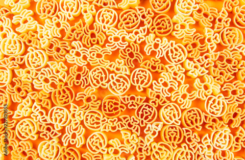 Halloween tricolore pasta on orange background,minimal food concept.