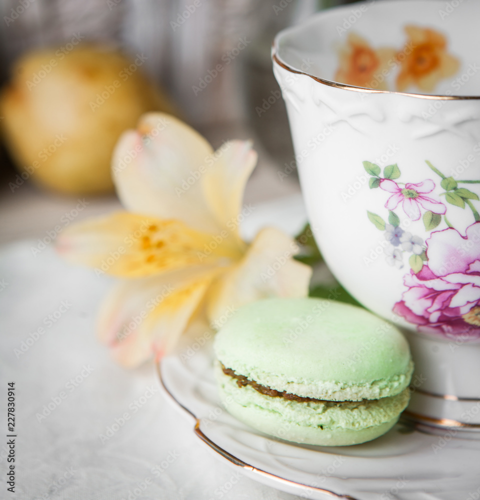 Pistachio macaroon and cup of tea