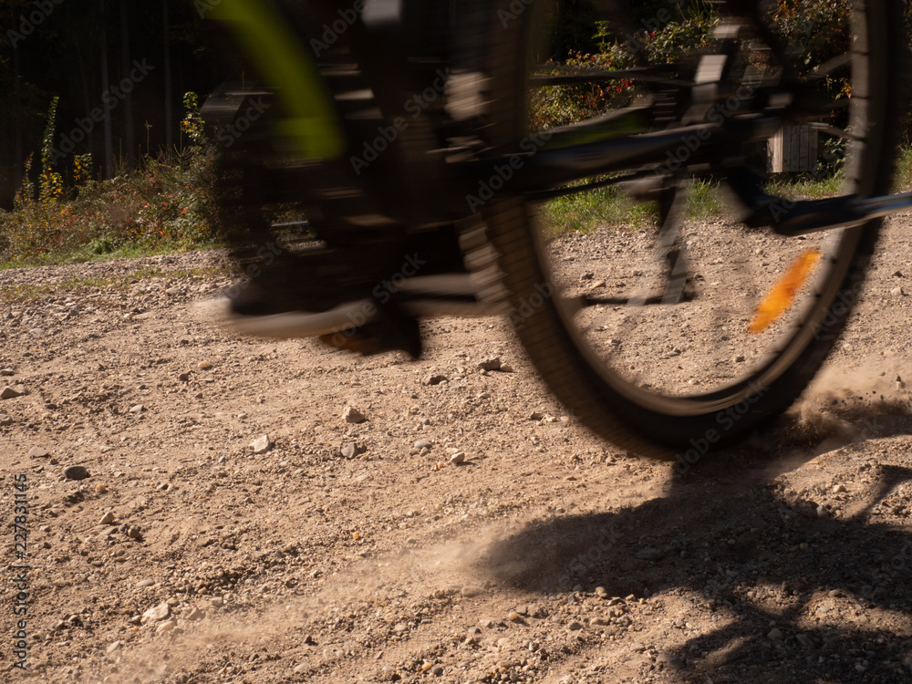 bike driving fast though a dust road bike driving fast though a dust road