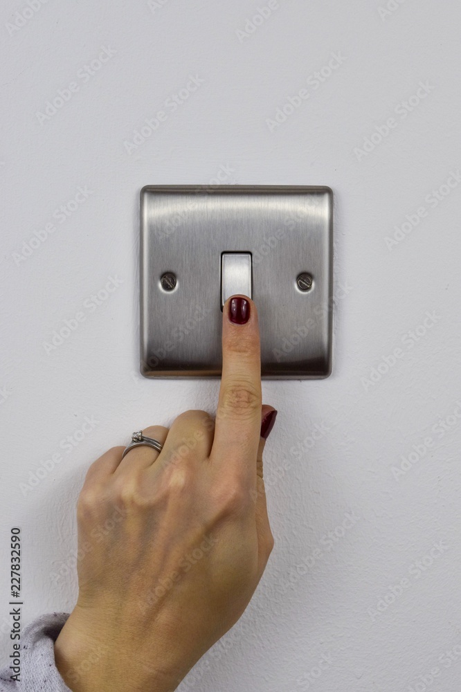 Finger on a light switch