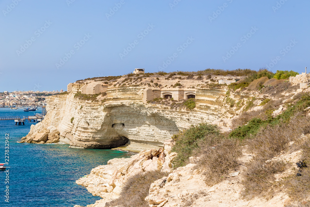 Marsaxlokk, Malta. Old artillery battery in the rocks